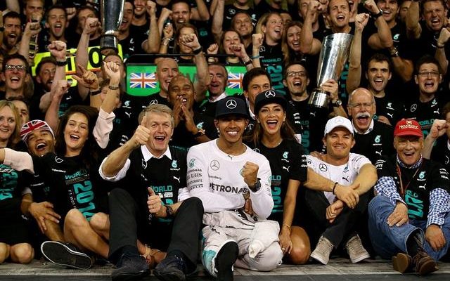 Hamilton and Scherzinger sit after the driver won the World Championship